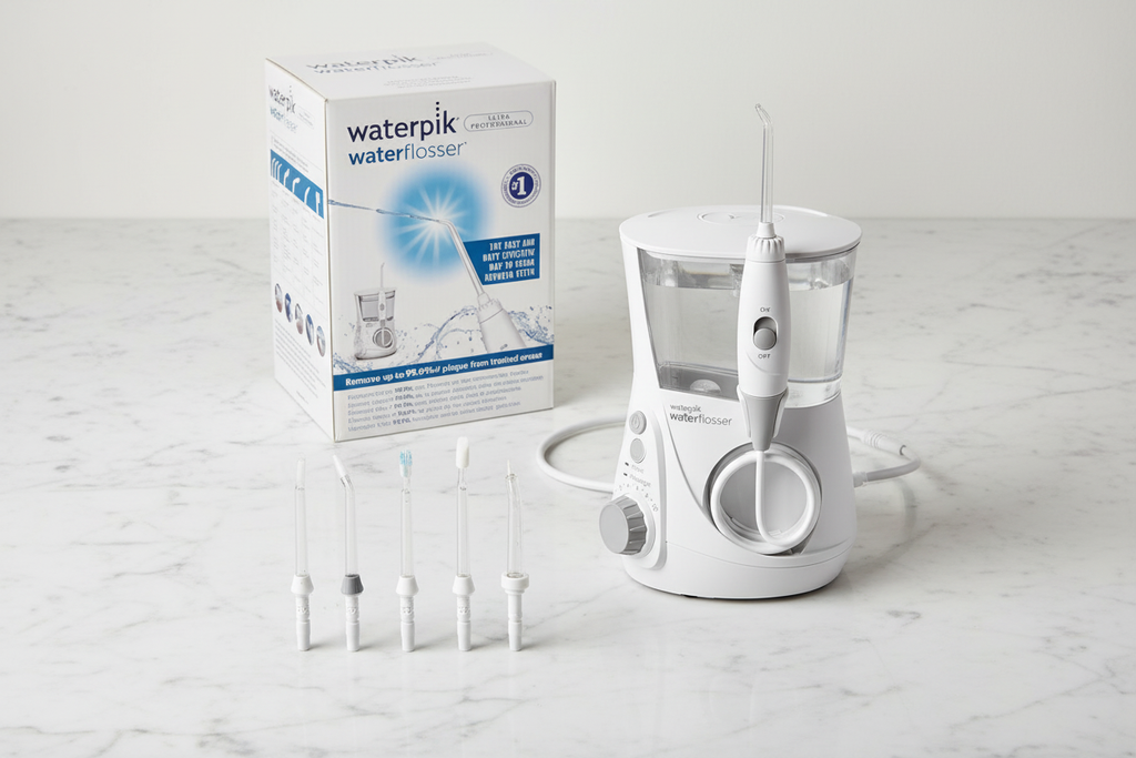 Waterpik Ultra Professional med 5 munstycken på marmor